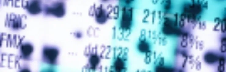 Blurred numbers and letters on screen.